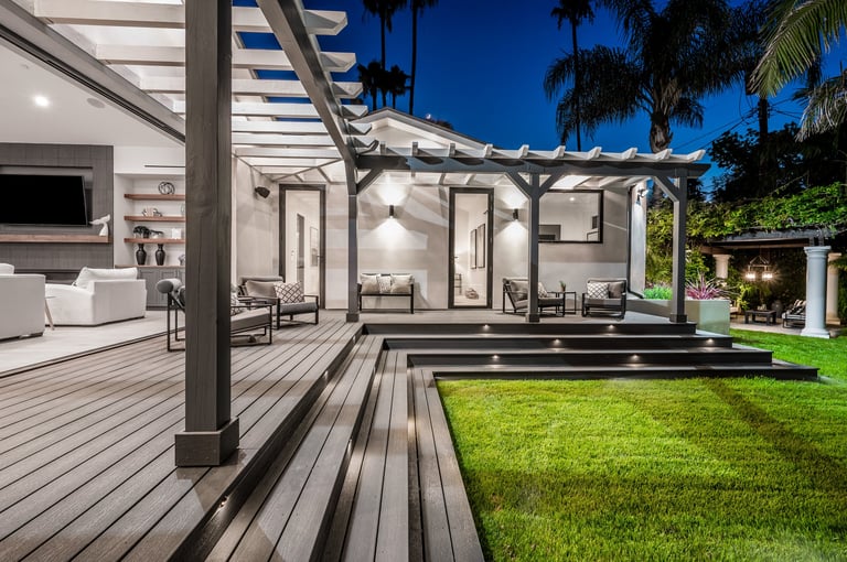 An outdoor seating area with sofas and a coffee table in a modern new construction home in Los Angeles